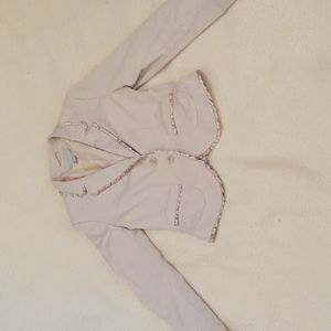 Nude pink blazer with ruffled trim